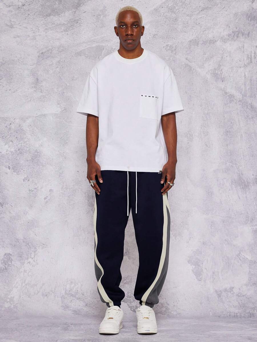 بنطلون جوغر فضفاض بتصميم مريح وأشرطة جانبية متباينة اللون من سومون – شي إن