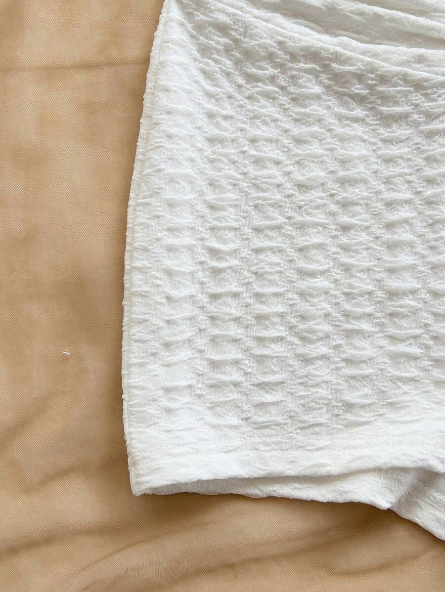 جمبسوت أنثوي أبيض من Soleia  قماش محبوك