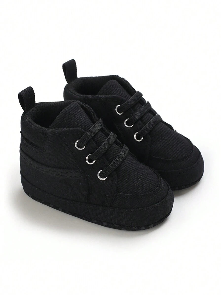 حذاء المشي الأولى للأطفال حديثي الولادة من الأولاد والبنات، مصنوعة من القماش بلون واحد