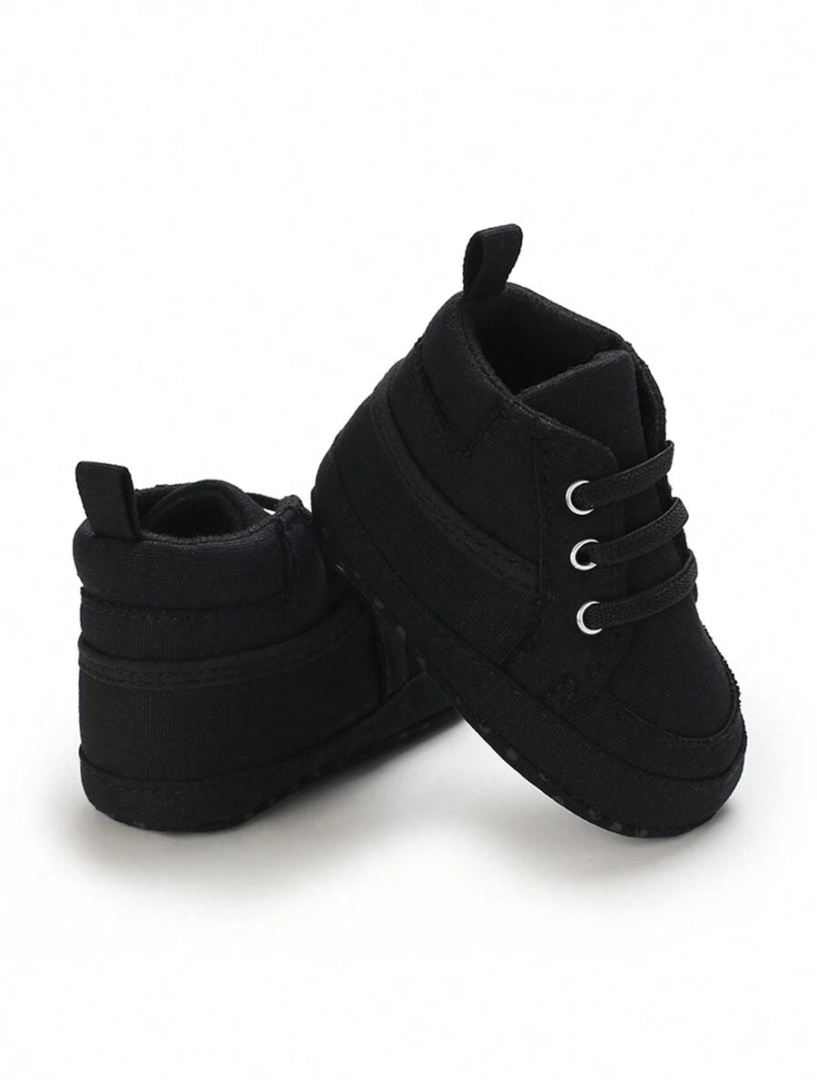 حذاء المشي الأولى للأطفال حديثي الولادة من الأولاد والبنات، مصنوعة من القماش بلون واحد