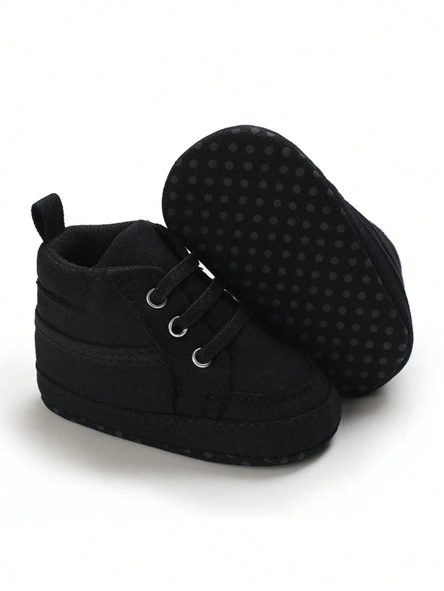 حذاء المشي الأولى للأطفال حديثي الولادة من الأولاد والبنات، مصنوعة من القماش بلون واحد