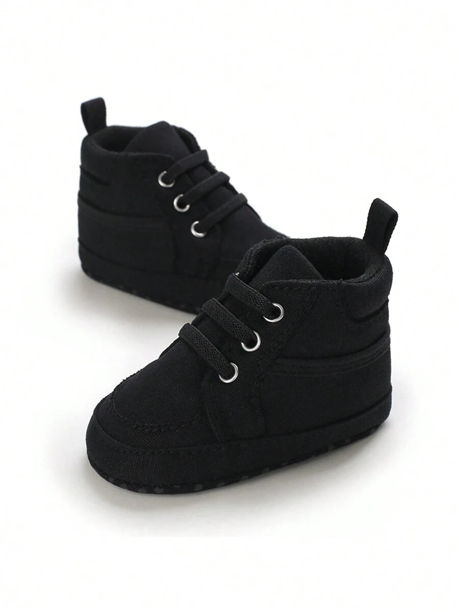 حذاء المشي الأولى للأطفال حديثي الولادة من الأولاد والبنات، مصنوعة من القماش بلون واحد