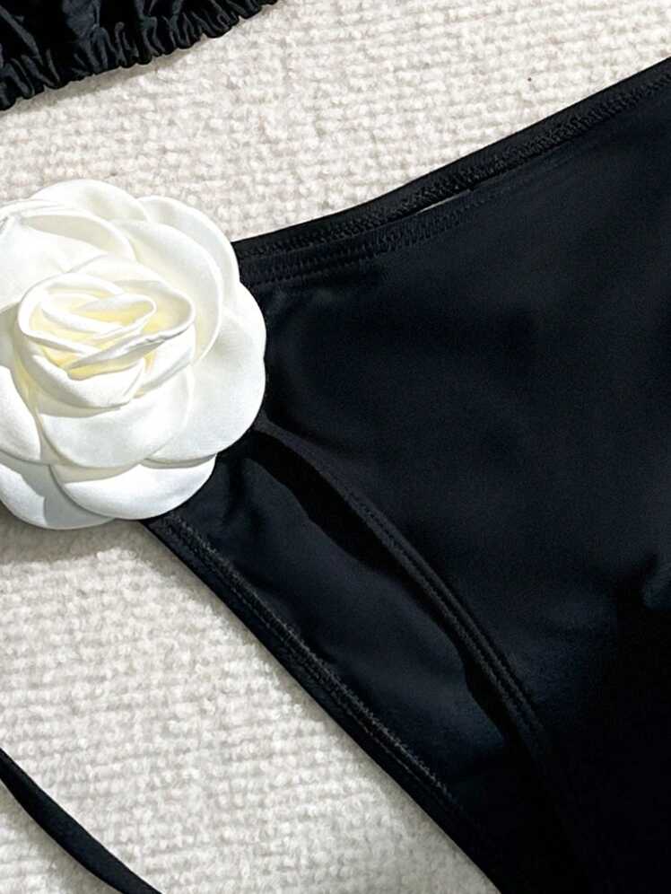 مايوه نسائي قطعتين باللون الأسود بتفاصيل وردية أنيقة