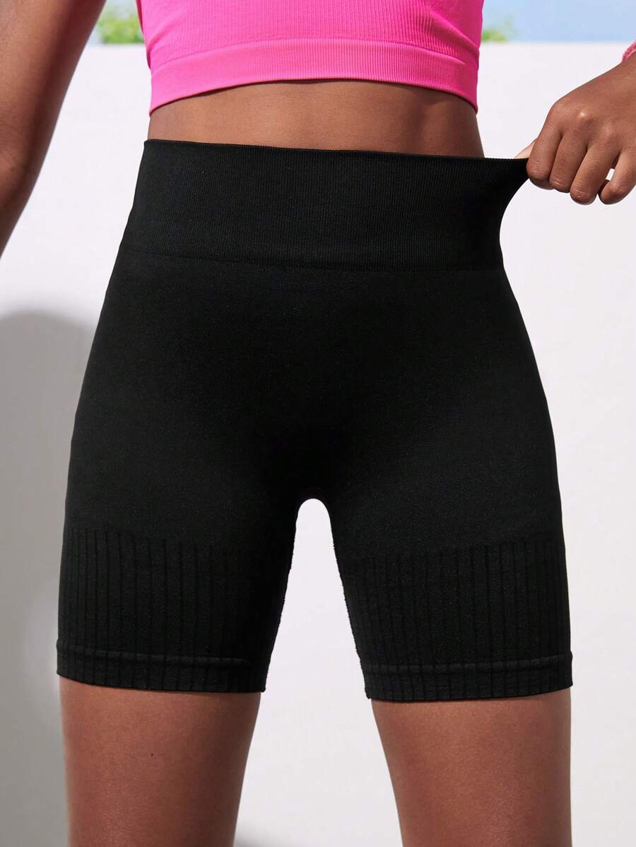 شورت رياضي أسود سلس للبنات من SHEIN Tween – مناسب للجري، اليوغا،