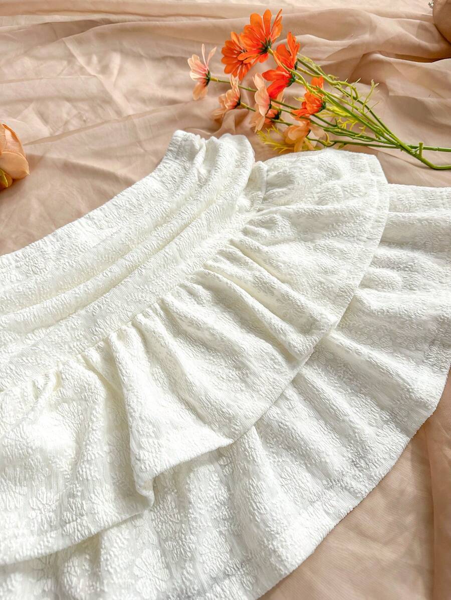 تنورة نسائية من Soleia بحواف مطرزة وفتحة غير متماثلة مع طيات