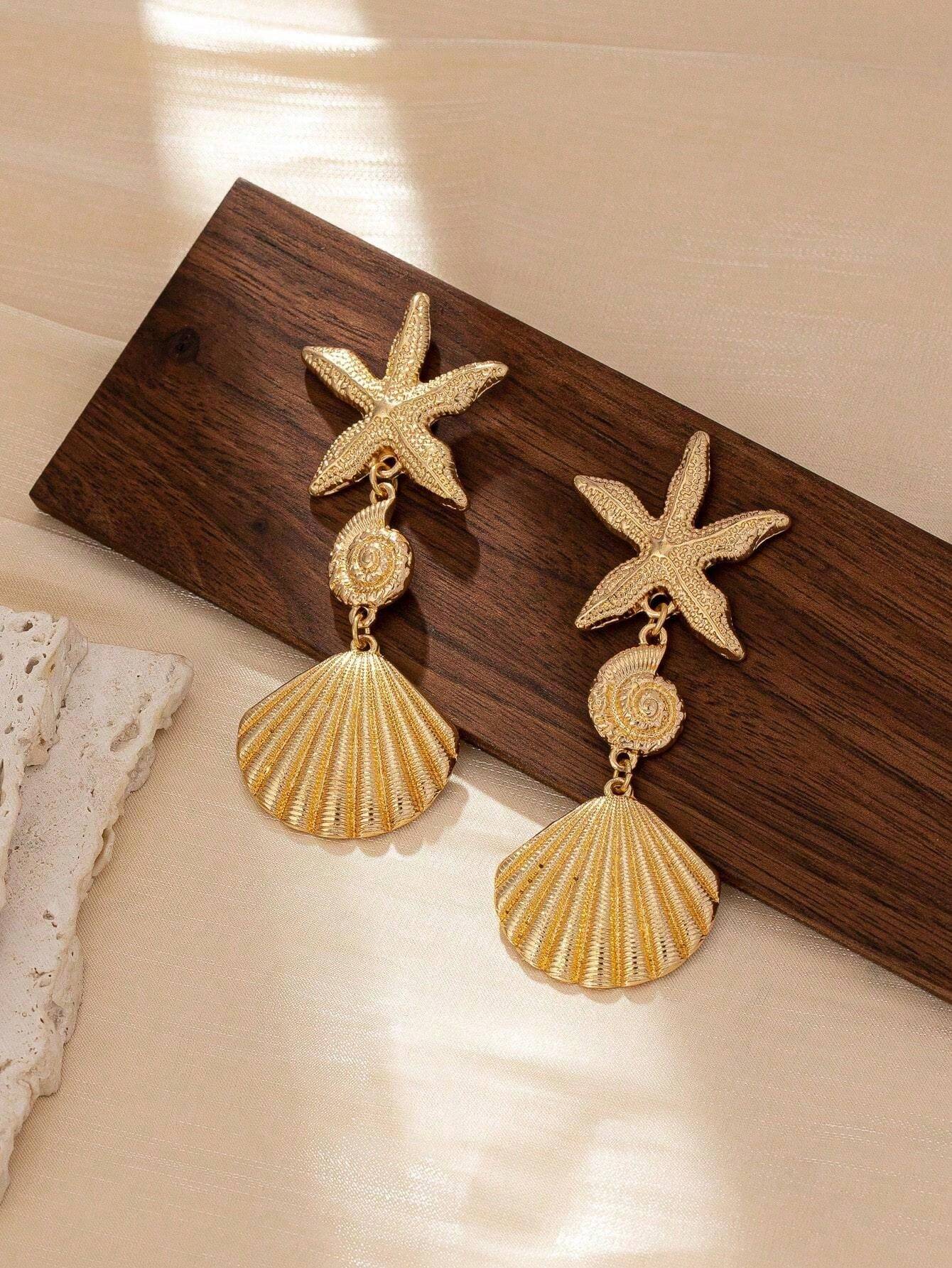 أقراط متدلّية نجمة بحر وصدَف