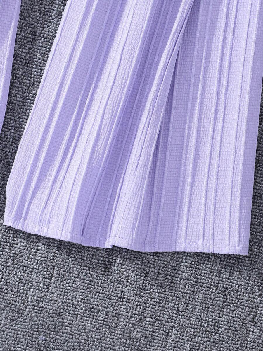 جمبسوت بأزرار أمامية وحواف كشكشة وساق واسعة من شي إن – توين جيرل