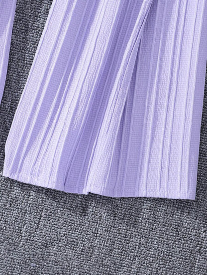 جمبسوت بأزرار أمامية وحواف كشكشة وساق واسعة من شي إن – توين جيرل