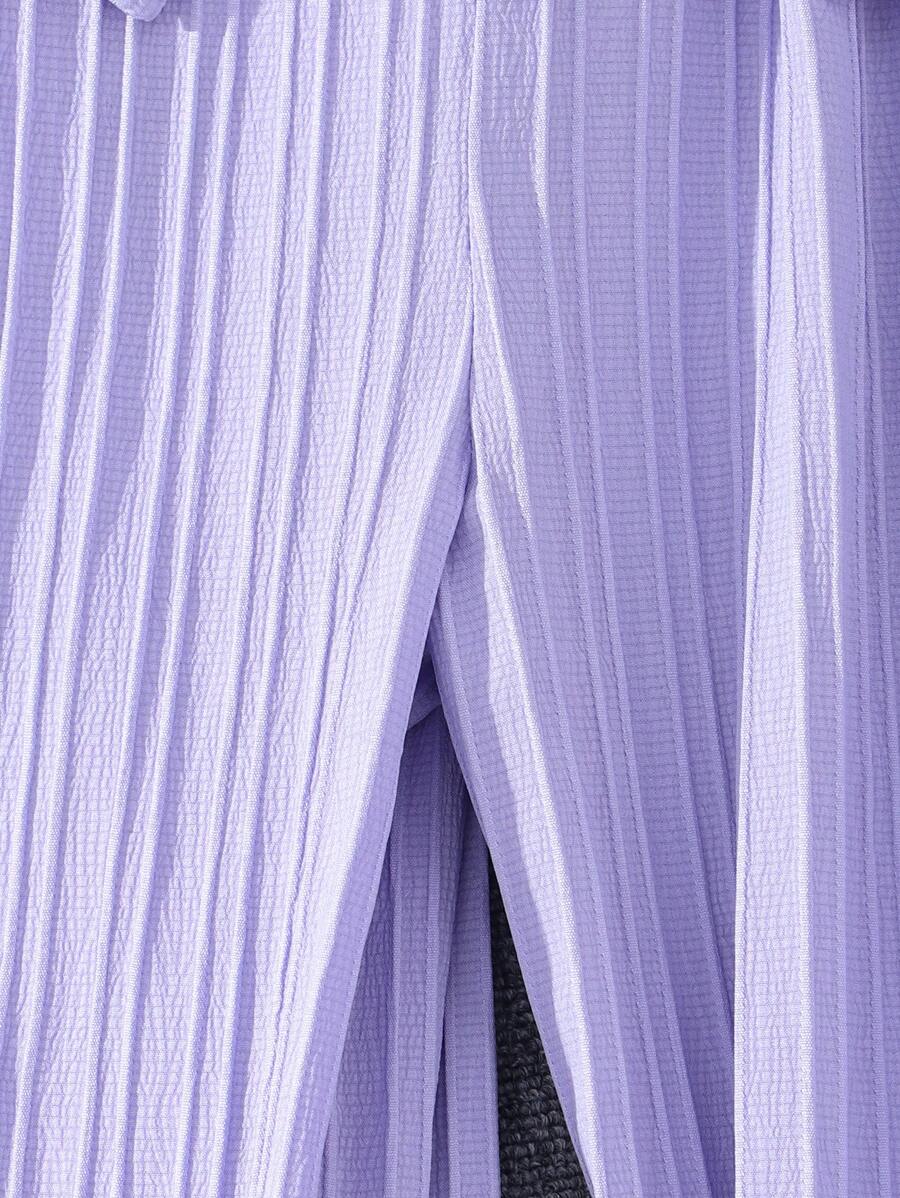 جمبسوت بأزرار أمامية وحواف كشكشة وساق واسعة من شي إن – توين جيرل