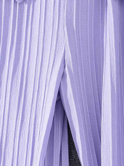 جمبسوت بأزرار أمامية وحواف كشكشة وساق واسعة من شي إن – توين جيرل