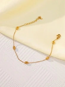 سوار من ستانلس ستيل مطلي بالذهب عيار 18 ومزين بخرزات بيضاوية متعددة