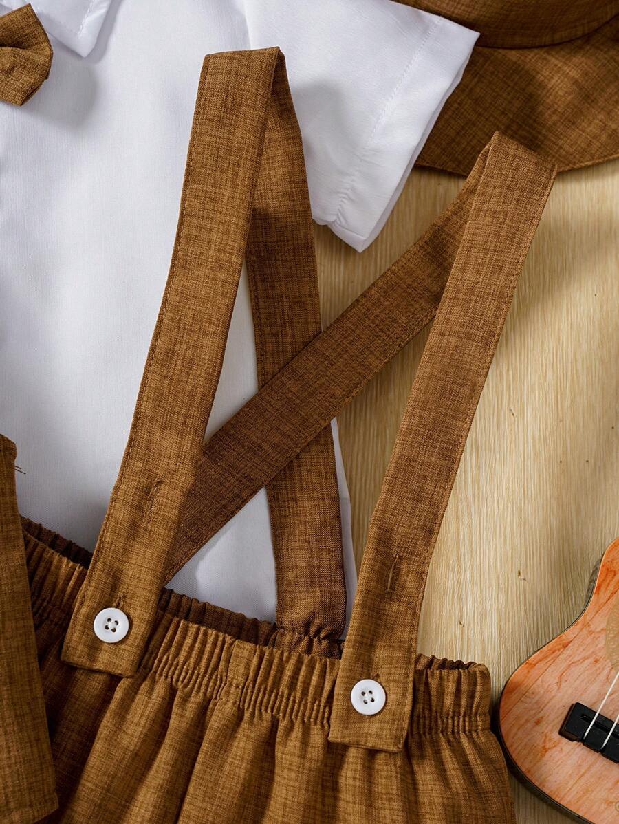 طقم أولادي أنيق من Shein مكوَّن من قميص كم قصير وربطة عنق مع فيست وشورت جاكار