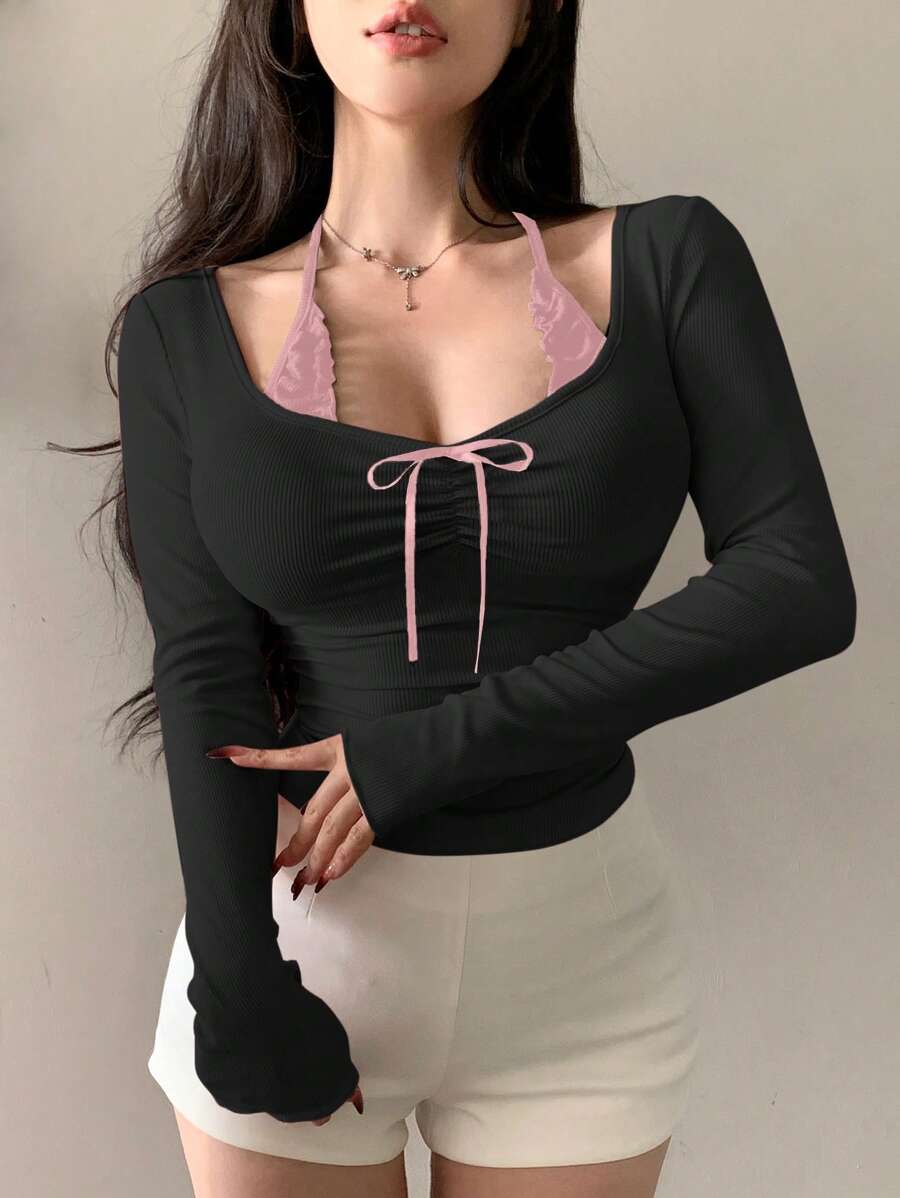 توب نسائي صيفي أسود بأكمام طويلة وخصر مشدود ومزين بفيونكة من ديزي