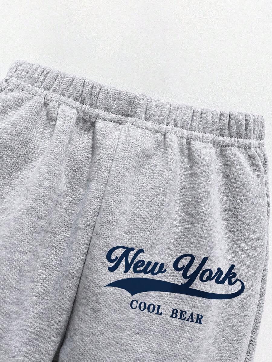 طقم سويت شيرت وبنطلون رياضي دافئ بياقة دائرية مطبوع عليه رسوم متحركة للأولاد الصغار Shein