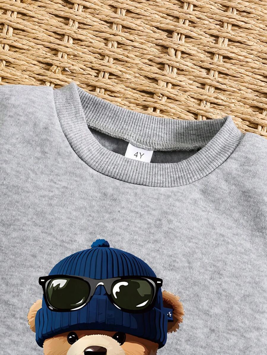 طقم سويت شيرت وبنطلون رياضي دافئ بياقة دائرية مطبوع عليه رسوم متحركة للأولاد الصغار Shein