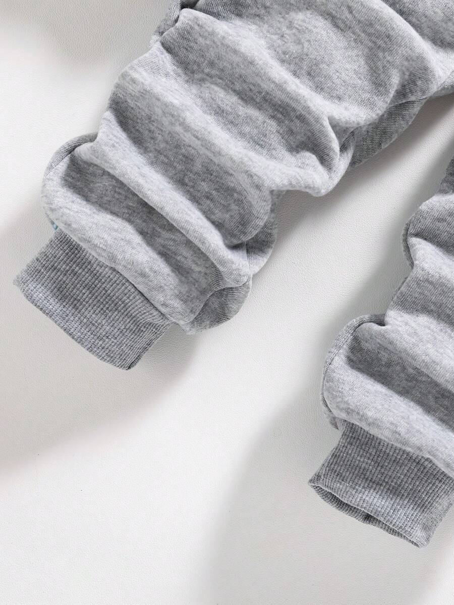 طقم سويت شيرت وبنطلون رياضي دافئ بياقة دائرية مطبوع عليه رسوم متحركة للأولاد الصغار Shein