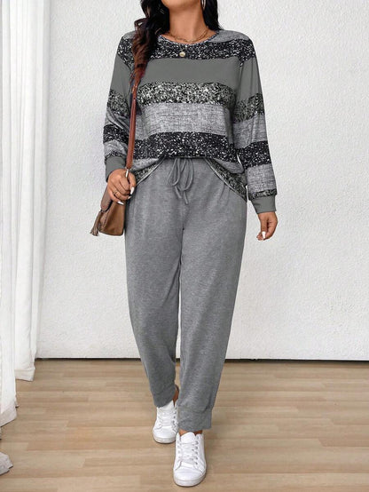 طقم نسائي (قطعتين): بلوزة مخططة بياقة دائرية وأكمام طويلة وبنطلون برباط أمامي من مجموعة لون – شي إن