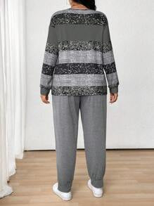 طقم نسائي (قطعتين): بلوزة مخططة بياقة دائرية وأكمام طويلة وبنطلون برباط أمامي من مجموعة لون – شي إن