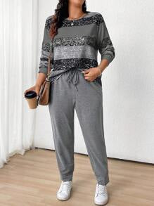 طقم نسائي (قطعتين): بلوزة مخططة بياقة دائرية وأكمام طويلة وبنطلون برباط أمامي من مجموعة لون – شي إن