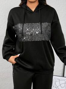 طقم نسائي (قطعتين): هودي مزين بالترتر وبنطلون مخطط بشريط جانبي من كالفايا