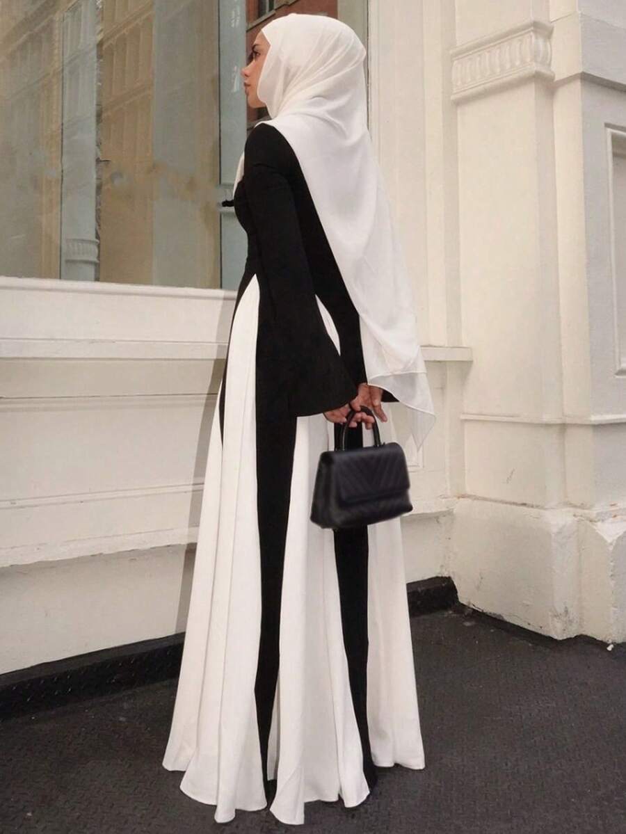 قطعة واحدة من فستان نسائي طويل أنيق بلونين متدرجين متباينين، ألوان ربيعية ناعمة، أكمام طويلة