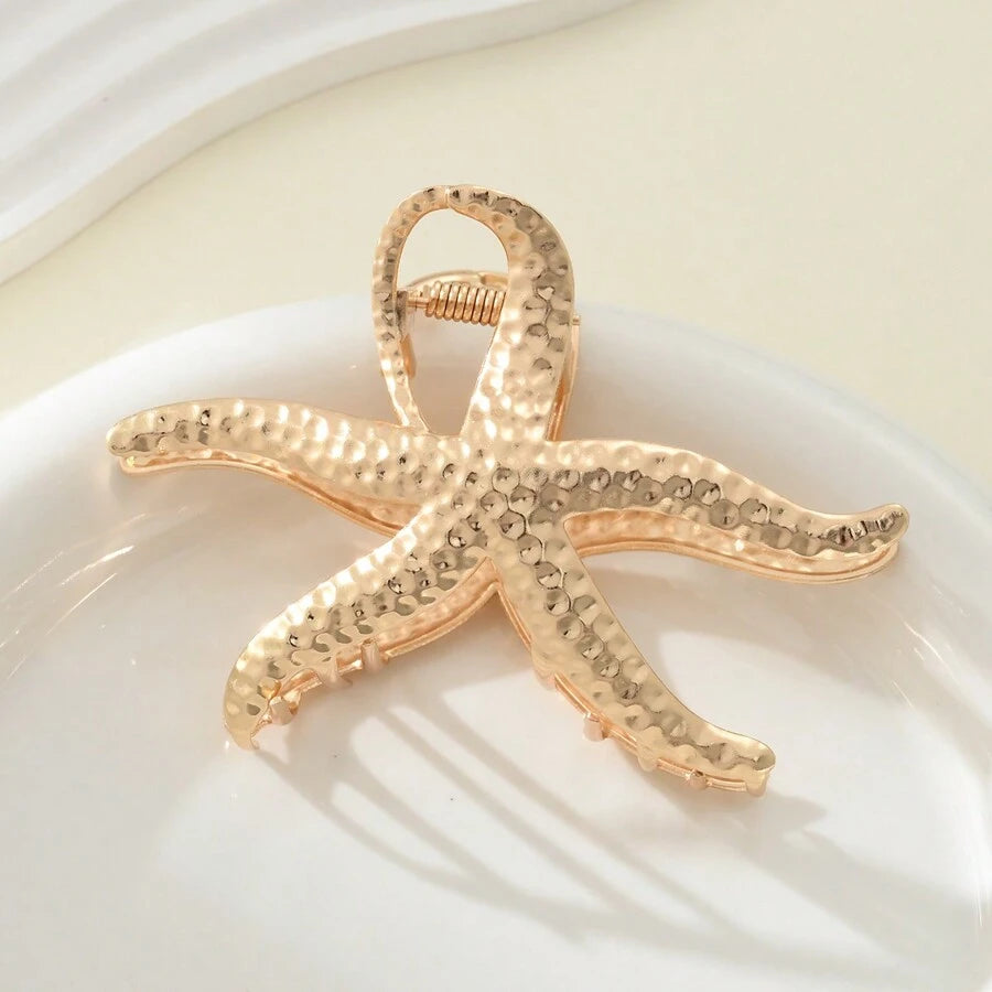 مشبك شعر ذهبي بتصميم نجمة البحر – إكسسوار أنيق للنساء