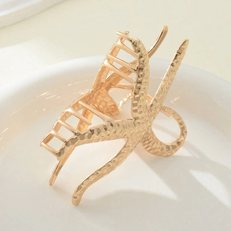 مشبك شعر ذهبي بتصميم نجمة البحر – إكسسوار أنيق للنساء