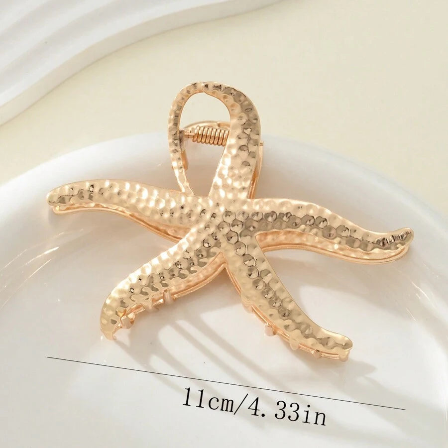 مشبك شعر ذهبي بتصميم نجمة البحر – إكسسوار أنيق للنساء