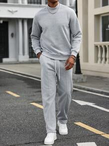 طقم رجالي: بلوفر برقبة عالية وبنطلون سادة من مانفينيتي هوم