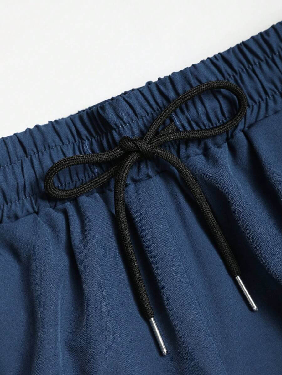 طقم مكوّن من تيشيرت وشورت رجالي من Manfinity RSRT بتصميم شجرة جوز الهند المتدرجة