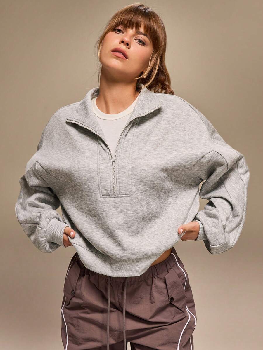 سويت شيرت فضفاض بأكمام طويلة وياقة واقفة وسحاب نصفي من Hanevo للنساء بتصميم أمريكي كاجوال