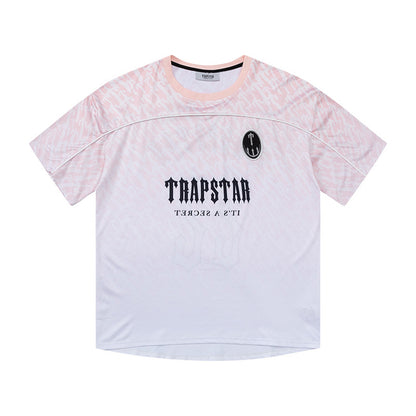 تي شيرت نسائي من Trapstar مطبوع عليها رسومات جرافيكية