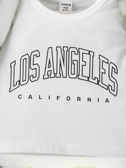 تيشيرت أبيض من Shopyneer بطبعة Los Angeles باللون الأسود مع فيست أخضر كاجوال للأطفال